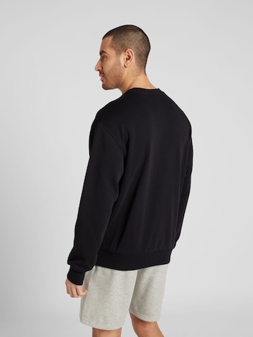 Champion Authentic Athletic Apparel Sweatshirt in Black