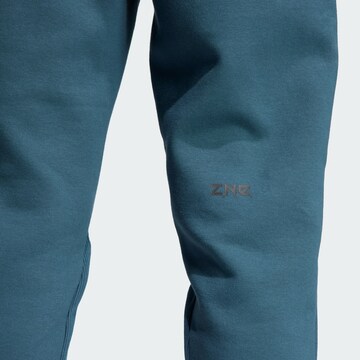 ADIDAS SPORTSWEAR Tapered Sportbroek 'Z.N.E. Premium' in Blauw