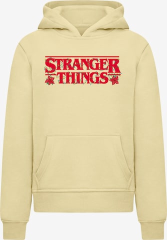 ABSOLUTE CULT Sweatshirt 'Stranger Things - Christmas Logo' in Gelb: Vorderseite