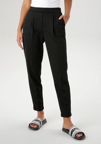 Aniston SELECTED Tapered Pleat-Front Pants in Black: front