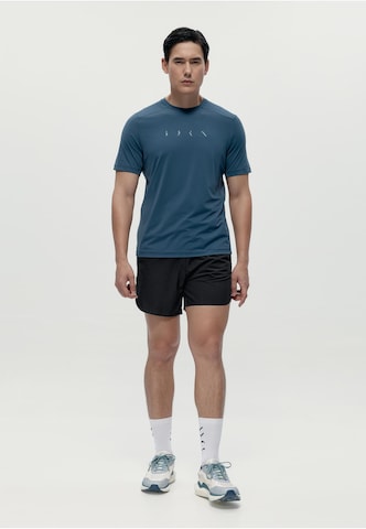 T-Shirt fonctionnel 'Volta' Born Living Yoga en bleu