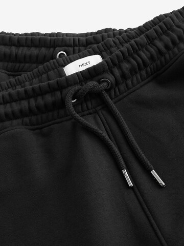 Next Дънки Tapered Leg Панталон в черно