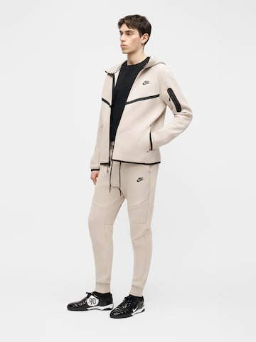 Nike Sportswear Zwężany krój Spodnie 'Tech Fleece' w kolorze beżowy