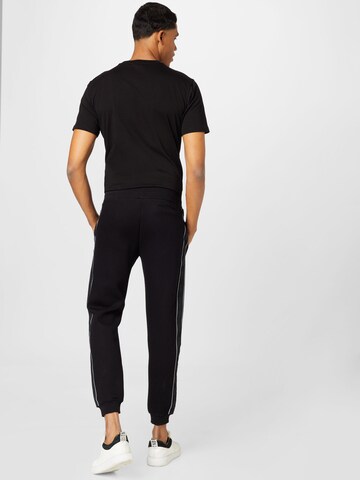 GUESS Tapered Sporthose 'Mickey' in Schwarz