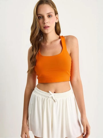 Haut Bianco Lucci en orange