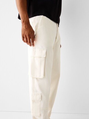 Bershka Loose fit Cargo trousers in White