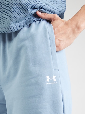 UNDER ARMOUR - Tapered Pantalón deportivo en azul