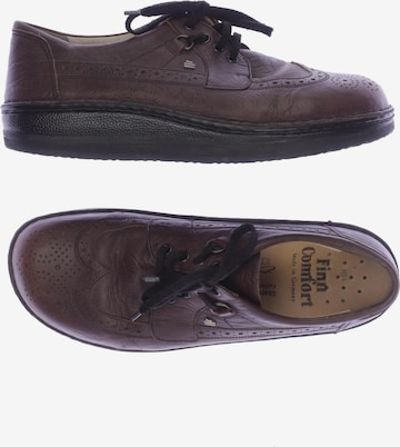 Finn Comfort Flats & Loafers in 45 in Brown: front