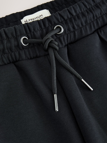 melns Next Standarta Bikses