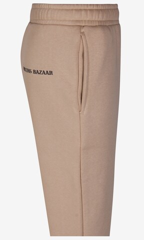 Bruuns Bazaar Kids Zwężany krój Spodnie 'Ragnhild' w kolorze beżowy