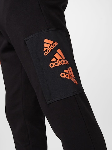 ADIDAS SPORTSWEAR Tapered Sports trousers 'Essentials Brandlove Fleece' in Black