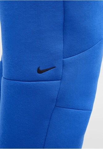 NIKE Tapered Broek in Blauw