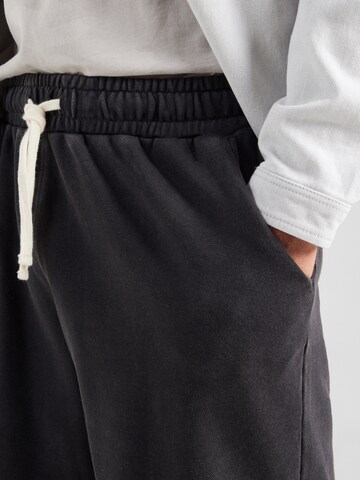 Largi Pantaloni sport 'TREVOR' de la ELLESSE pe negru