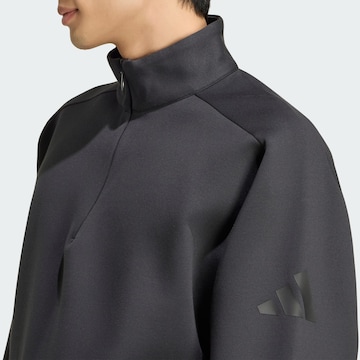ADIDAS SPORTSWEAR - Camiseta deportiva en negro