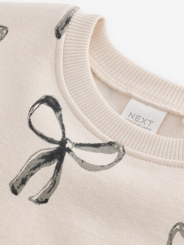 Next Klänning i beige