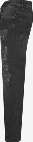 Skinny Jeans di Karl Kani in nero