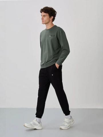 Survêtement Tommy Life en vert : devant