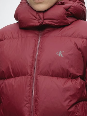 Calvin Klein Jeans Vinterjacka 'ESSENTIAL' i röd