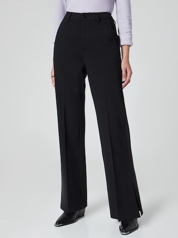 florence by mills exclusive for ABOUT YOU Trousers 'Tela' in Black: front