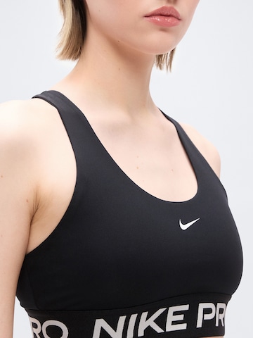 Bustino Reggiseno sportivo 'PRO' di NIKE in nero