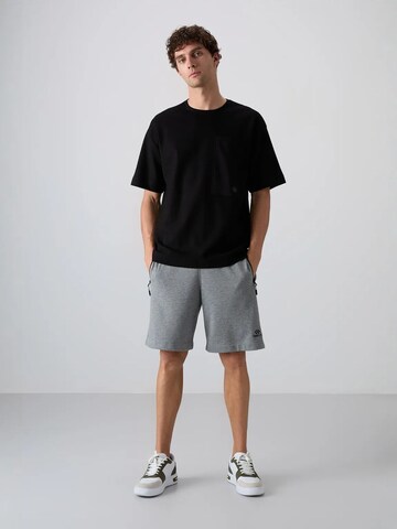 Tommy Life T-Shirts in Schwarz