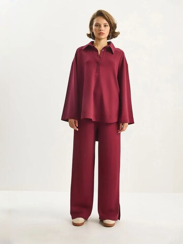 Completo pantalone di Bianco Lucci in rosso