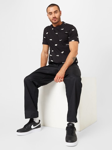 Loosefit Pantalon 'Club' Nike Sportswear en noir