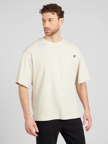 T-Shirt fonctionnel 'Rival' UNDER ARMOUR en beige : devant