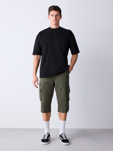 Next Normální Kapsáče – zelená: přední strana