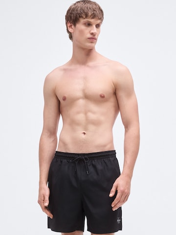 Calvin Klein Swimwear Trachten-housut värissä musta