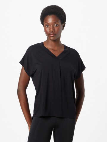 CURARE Yogawear Λειτουργικό μπλουζάκι σε μαύρο: μπροστά