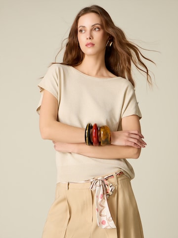 Pullover di oltre in oro