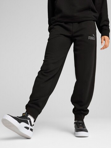PUMA - Tapered Pantalón deportivo 'Ess Nature 2.0' en negro: frente