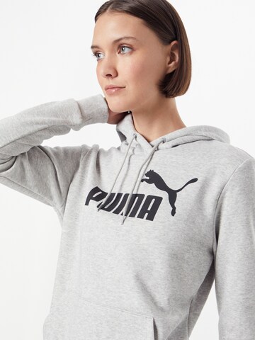 PUMA Sportsweatshirt 'ESSENTIAL Logo Hoodie' in Grau