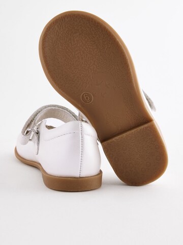 Next - Bailarina en blanco