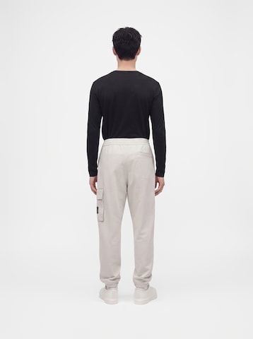 balta Calvin Klein Jeans Siaurėjantis Laisvo stiliaus kelnės