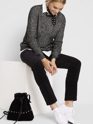 Slimfit Pantaloni di bonprix in nero