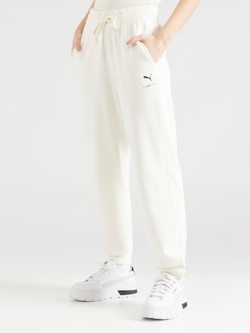 PUMA Tapered Sportbroek in Bruin: voorkant