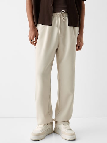 Loosefit Pantalon à pince Bershka en beige : devant