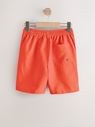 Next Plavecké šortky – oranžová