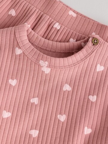 Set Next en rose