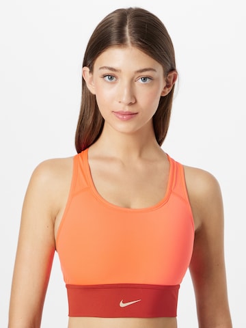 NIKE Bustier Biustonosz sportowy w kolorze pomarańczowy: przód