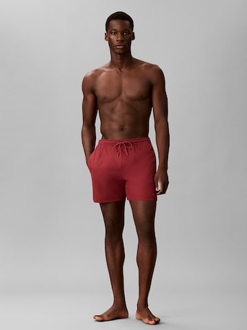 Calvin Klein Board Shorts in Red: front