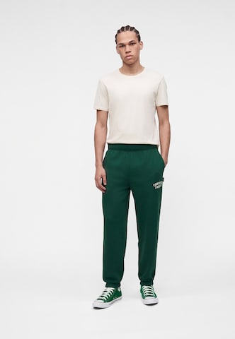 Tapered Pantaloni '1908' de la CONVERSE pe verde