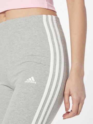 pelēks ADIDAS SPORTSWEAR Šaurs Sporta bikses 'Essentials'