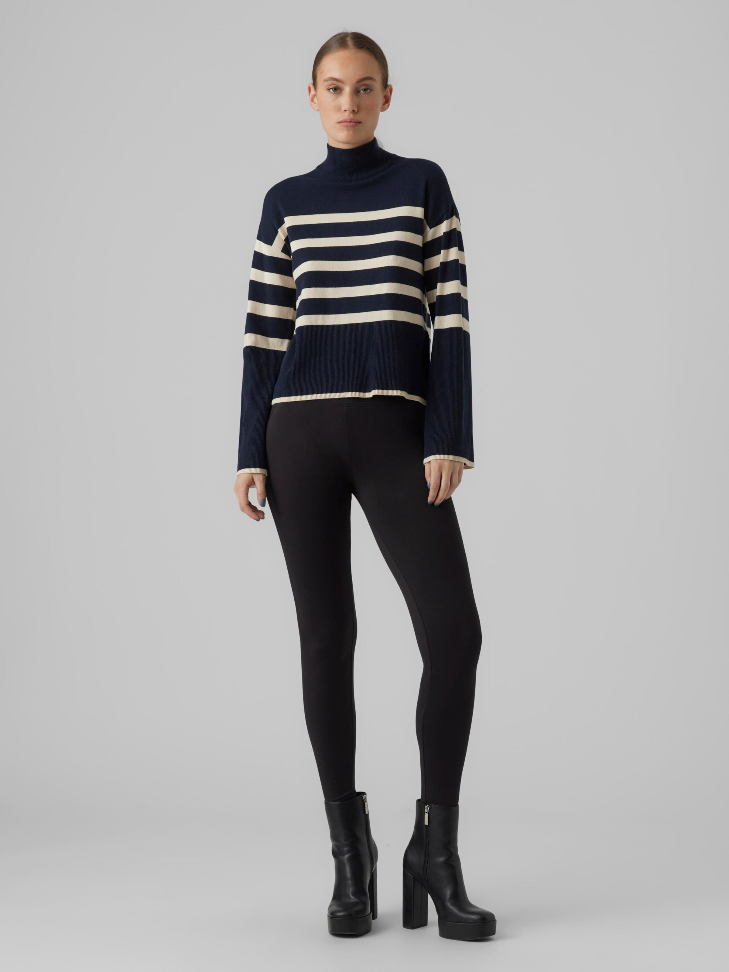Blue striped sweater with black leggings