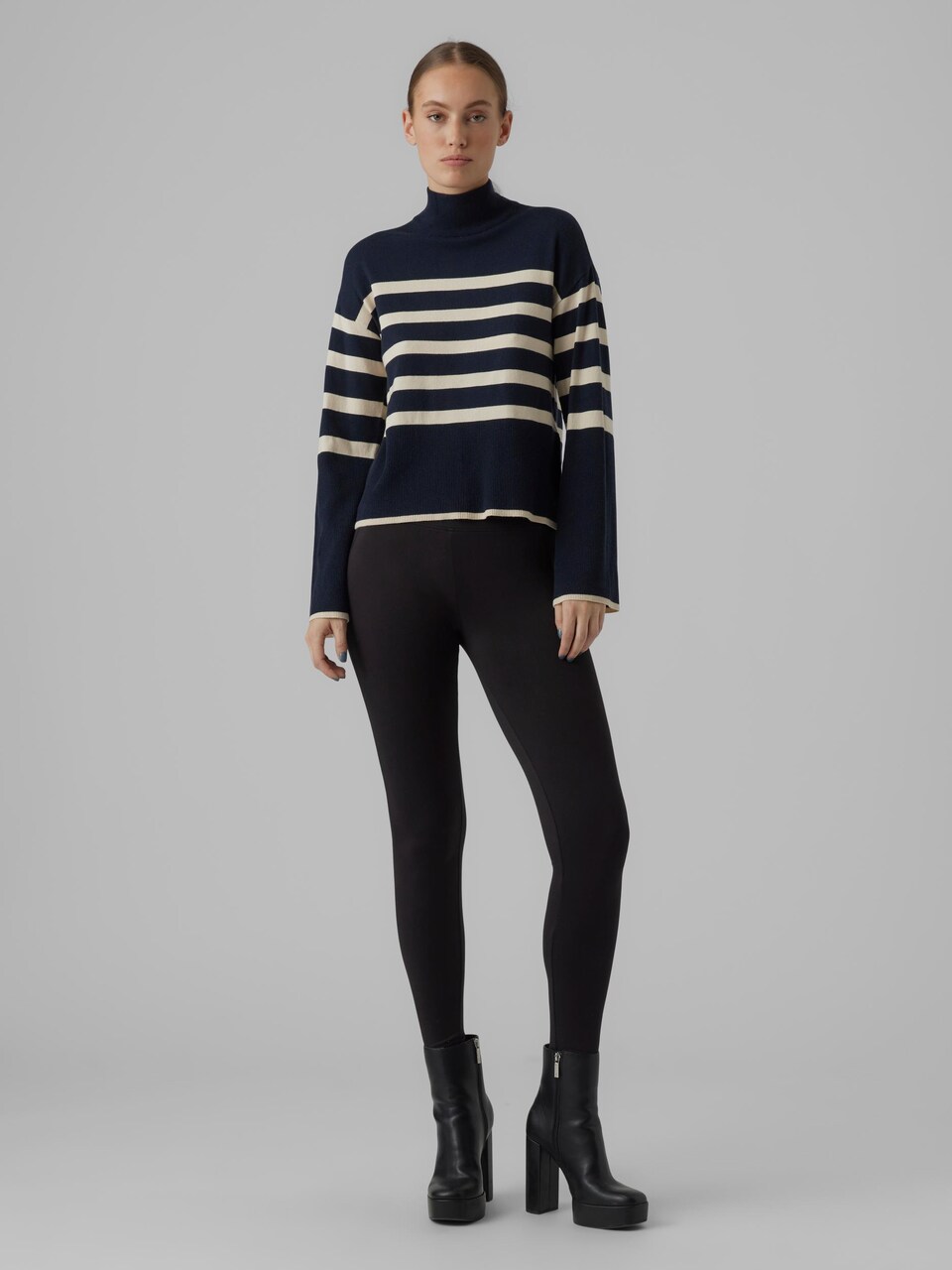 Blue striped sweater with black leggings