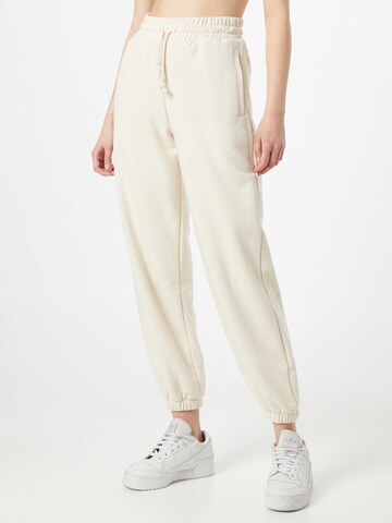 Effilé Pantalon ADIDAS ORIGINALS en beige : devant