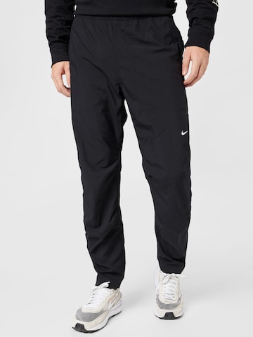 NIKE Regular Workout Pants in Black: front