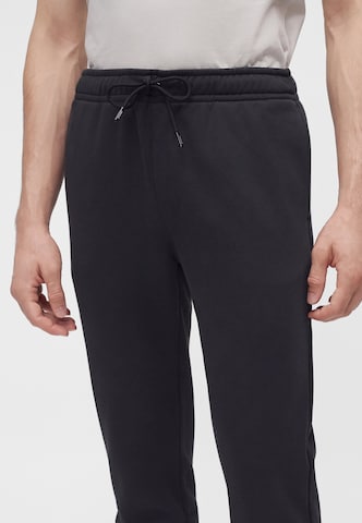 K-Way - Tapered Calças 'PHILBERT' em preto